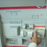 An ATM skimmer that fits over the card insert slot